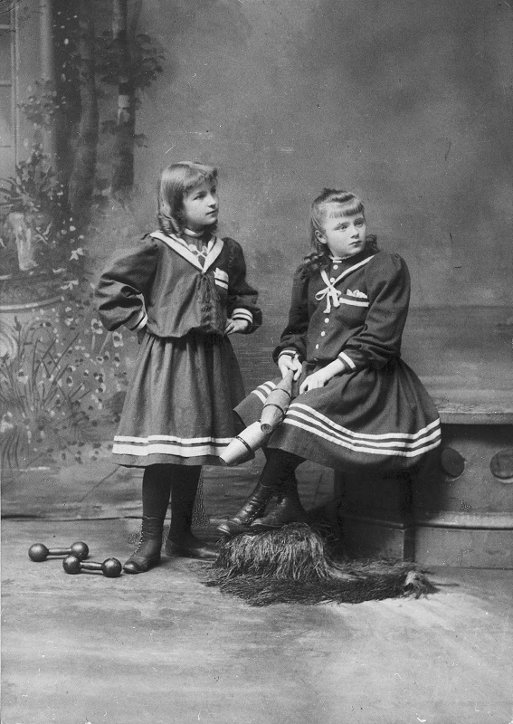 Two girls in athletic costumes. Description: Two girls in athletic costumes; Chicago, IL. Source: ICHi-25327. Chicago History Museum. Reproduction of photograph, photographer unknown. Date: ca. 1890.