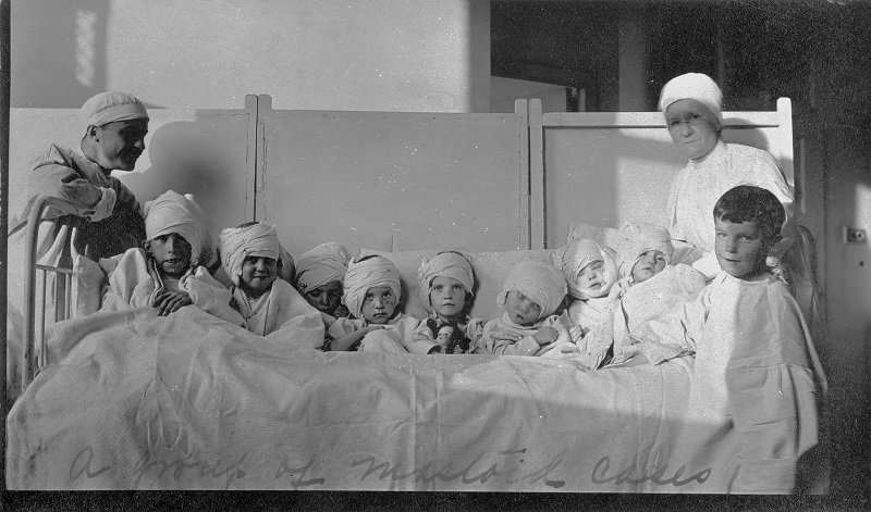 Post-mastoiditis surgical patients (young children) at Cook County Contagion Hospital. Description: Post-mastoiditis surgical patients (young children) at Cook County Contagion Hospital; Chicago, IL (G1986:484). Source: ICHi-26997. Chicago History Museum. Reproduction of photograph, photographer unknown. Date: 1912.