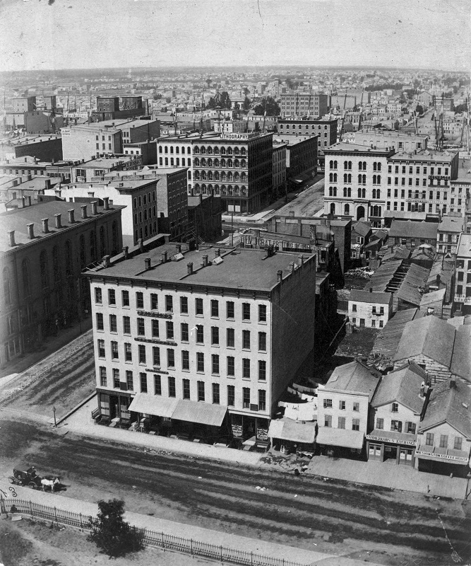 View of corner of Randolph Street and LaSalle Street looking north on LaSall Street from Court House Dome. Description: View of corner of Randolph Street and LaSalle Street looking north on LaSall Street from Court House Dome (1 of 11), Chicago, IL. Source: ICHi-05724. Chicago History Museum. Reproduction of photograph, photographer - ? Date: 1858.